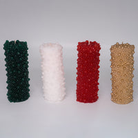 Candles with textured bead patterns