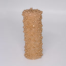 Candles with textured bead patterns