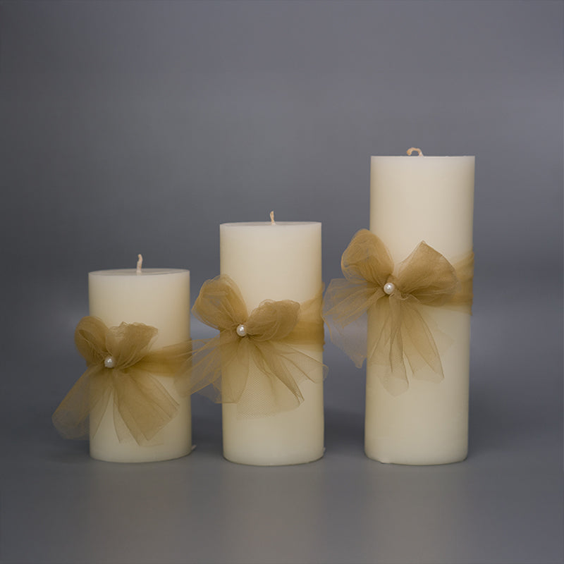 Gold Ribbon-Adorned White Candle